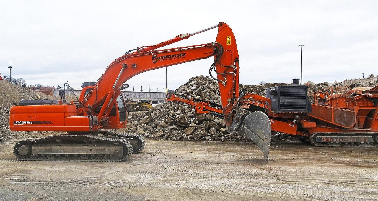 Excavator clearing rubble at a Hartford demolition site
