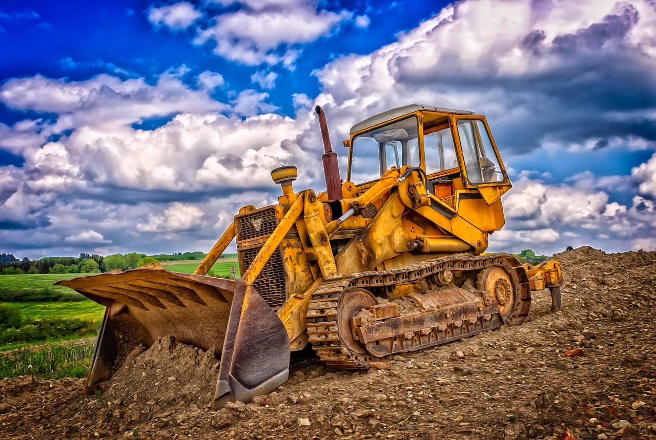 Bulldozer grading and leveling a residential lot near Hartford